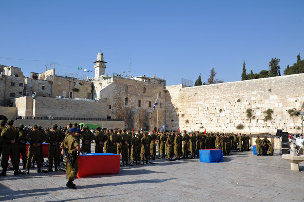 Israel Defense Force soldiers taking part in some kind of ceremony at the Western Wall
