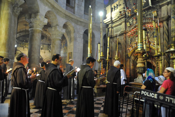 Roman Catholic Franciscan friars chanting at the Tomb of Christ, Church of the Holy Sepulchre