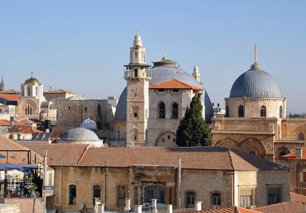 Rotunda and dome of the church of the Holy Sepulchre with the minaret of the Mosque of Omar