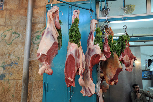 Meat hanging in front of a butcher shop in the Bethlehem Souq