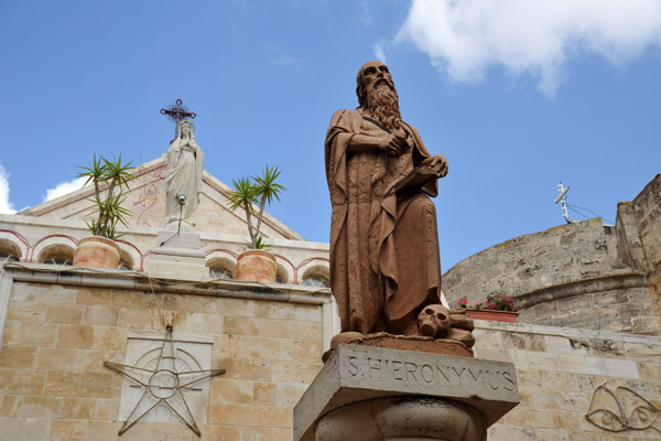 Statue of St. Jerome in the cloister courtyard in front of the Catholic Church of St. Catherine, Church of the Nativity