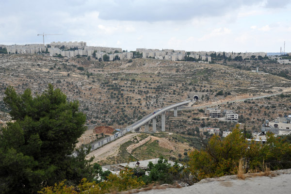 View of road tunnel on Highway 60 from Beit Jala with the Israeli settlement of Gilo (est 1973, pop 40,000) on the hilltop