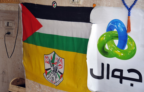 Yellow flag of al-'Asifah (The Storm) with a Palestinian flag, Bethlehem