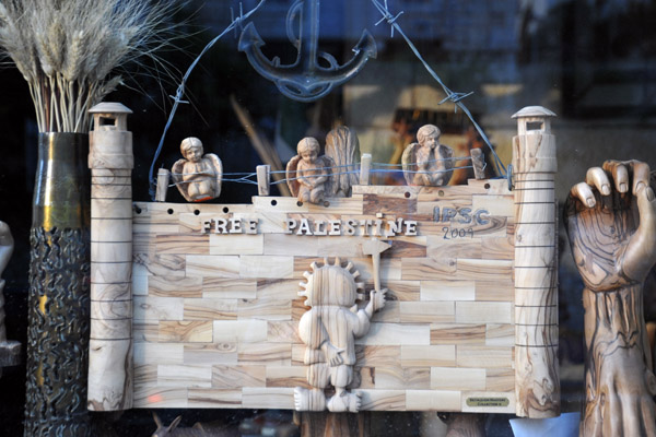 Separation barrier carved of olive wood with Free Palestine, Bethlehem