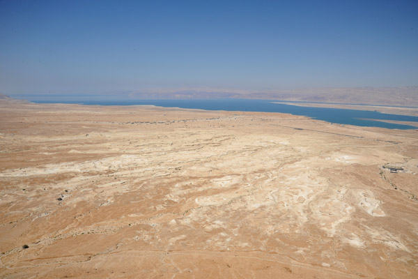 View of the desert at the base of Masada, the Dead Sea and the runway of Bar Yehuda Airport