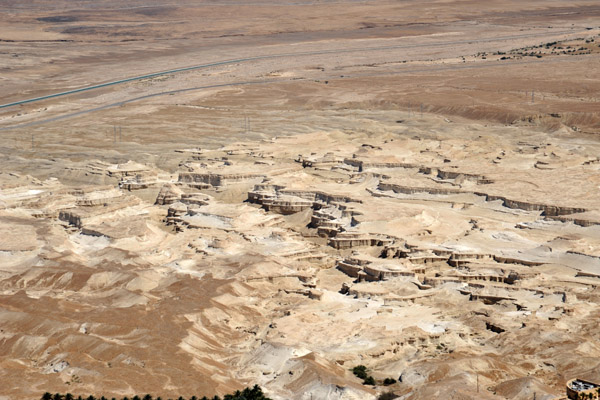 Stone formations in the desert at the base of Masada along Highway 90