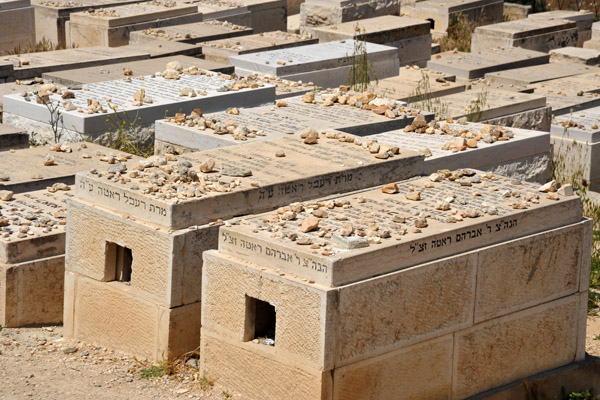 In Jewish tradition, mourners place stones on top of the graves rather than flowers,  Jewish cemetery, Mount of Olives