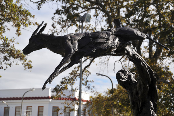 Sculpture of a cheetah leaping for a springbok in front of Stellenbosch Town Hall