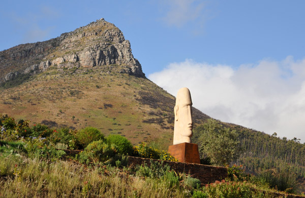 Sculpture of a giant head, Delaire Graff Estate, with the mountain Botmaskop, Helshoogte Road (R310)