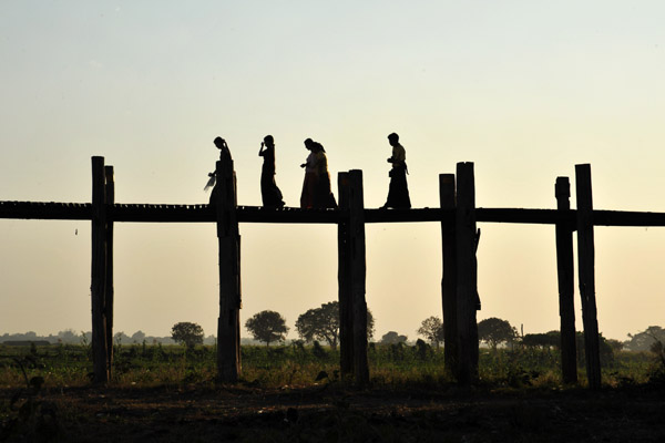 Villagers crossing U Bein's Bridge in the late afternoon, Amarapura