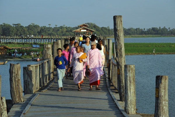 Buddhist nuns crossing U Bein's Bridge, Amarapura