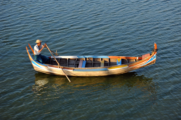 Taking a boat out on the lake at sunset is a great way to photograph the Teak Bridge