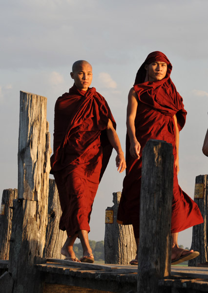 Monks crossing the Teak Bridge