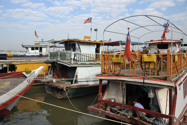 Dozens of wooden boats line the riverfront at Mandalay