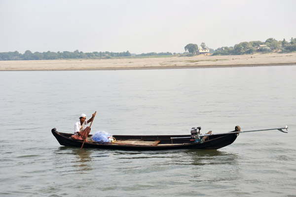 Fisherman paddling on the Irrawaddy near Mandalay