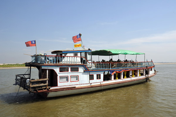 A large passenger boat heading downstream to Mandalay