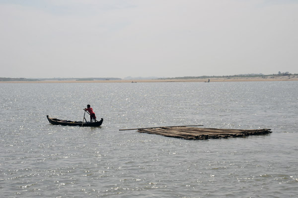 Small boat and a bamboo raft on the Irrawaddy River