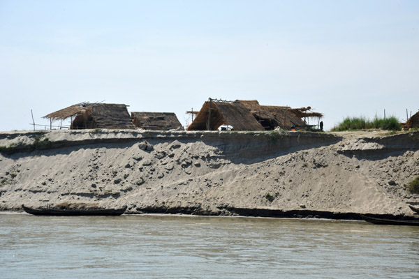 Temporary shelters erected on the river bank during the dry season