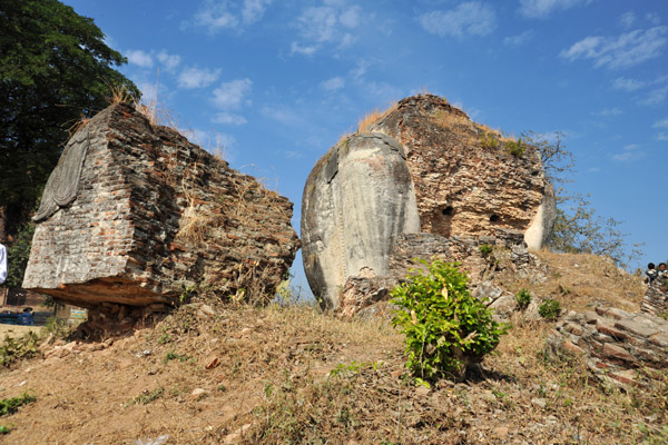 Ruins of the Chinthe (guardian lions) in front of Mingun Paya