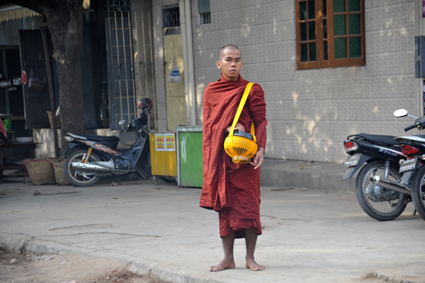 Burmese monk with a begging bowl, Mandalay