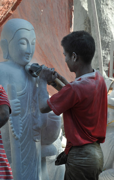 Young stone carver at work