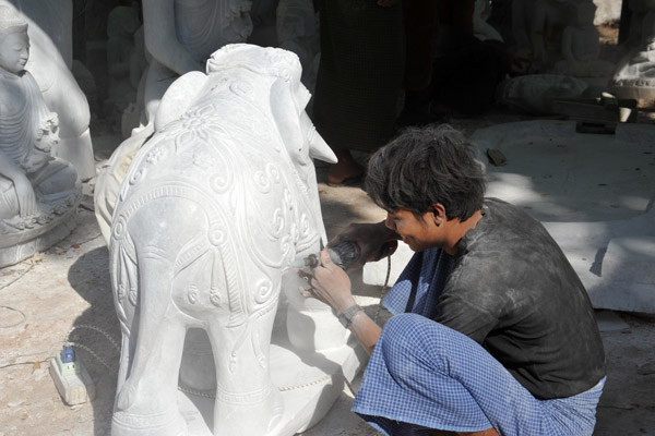 Putting the finishing touches on a stone elephant, Mandalay