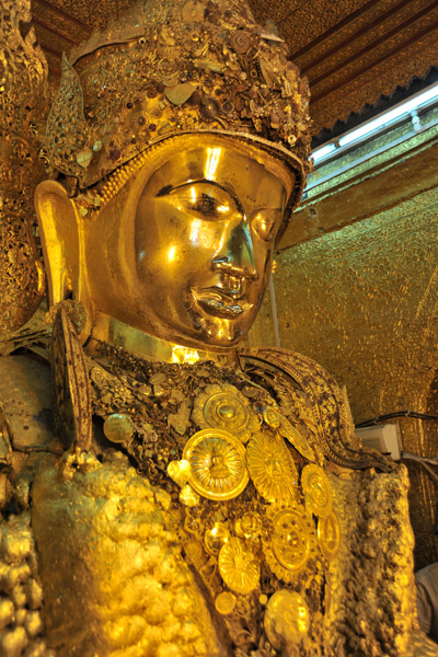 An ancient sculpture, the Mahamuni Buddha dates from the 1st C. AD