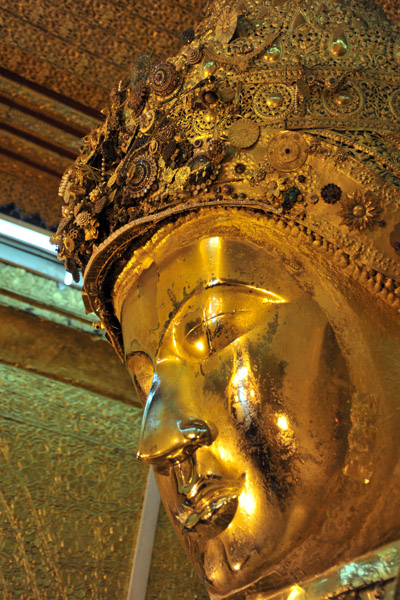 Golden face of the Mahamuni Buddha