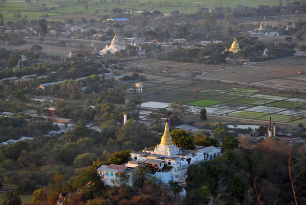 Monastery on the slopes of Mandalay Hill with paddy fields below