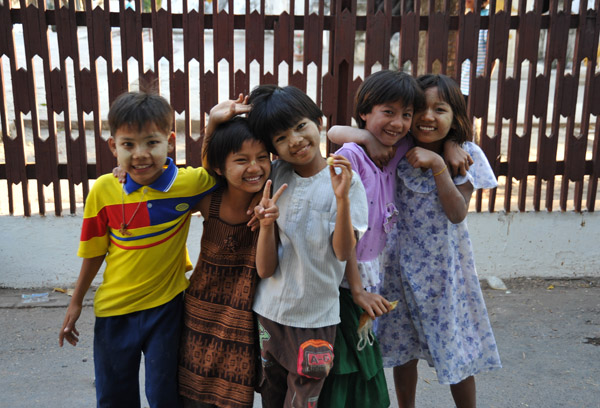 Most of them are wearing the traditional yellow Burmese face paint