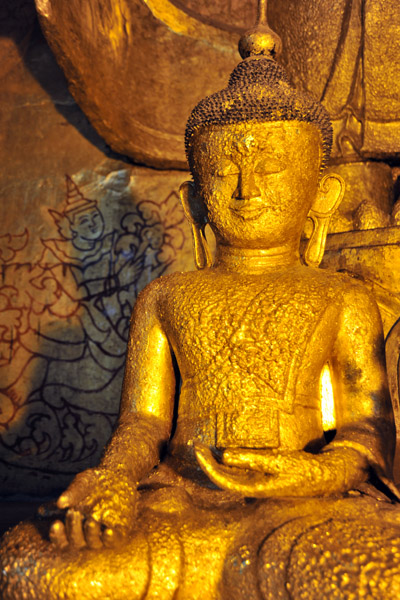 Gold covered statue at the foot of Gautama