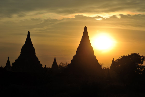Pagodas at sunset from ground level near Shwesandaw Paya, Bagan