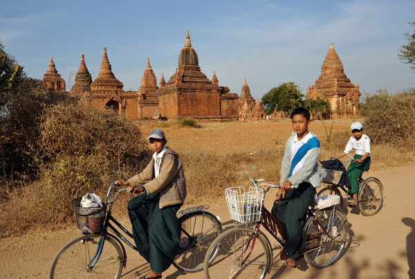 Bagan kids riding home from school (and probably off to sell postcards...)