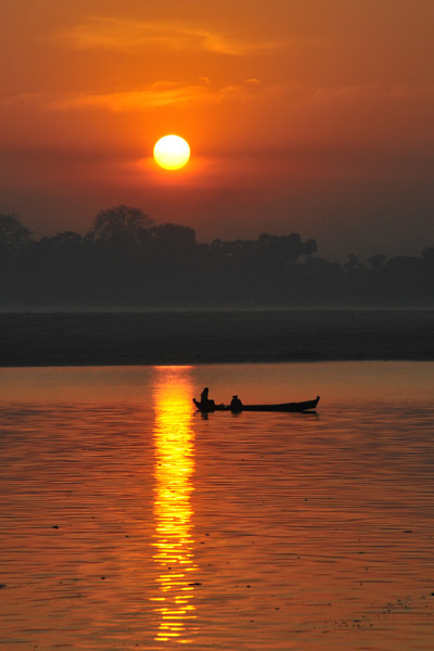 Irrawaddy sunrise with a small boat