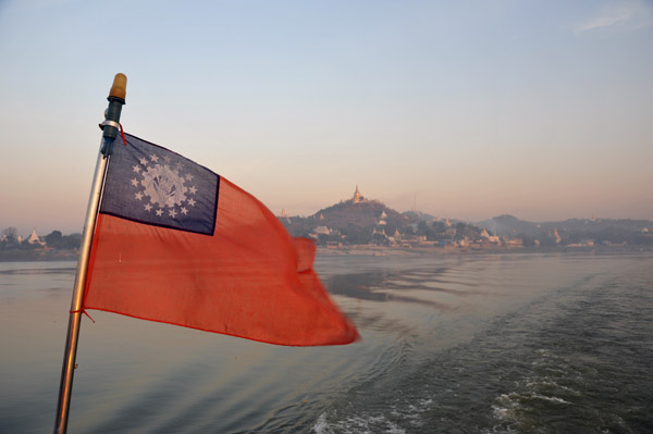Flag of the Union of Myanmar with the Sagaing Hills receding into the distance