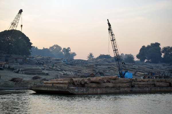 Barges unloading their timber on the banks of the river near the Sagaing Bridge - probably to transfer to rail