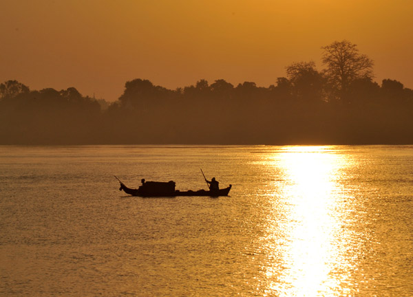 Boat with the reflection of the early morning sun