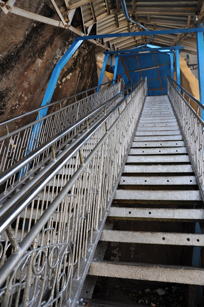 Climbing stairs to Popa Taung Kalat Monastery barefoot