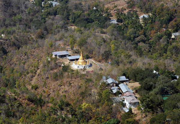 Monastery with a large golden pagoda at the base of Popa Taung Kalat