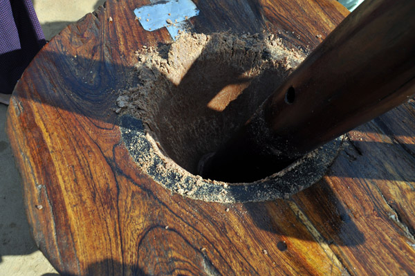 Palm fruit is placed inside the grinder