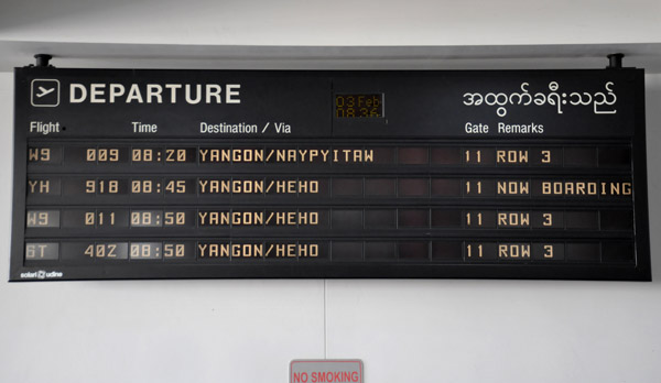 Departure board at Mandalay - 3 flights to Heho (Yangon Airways, Air Bagan, Air Mandalay) all within 5 minutes
