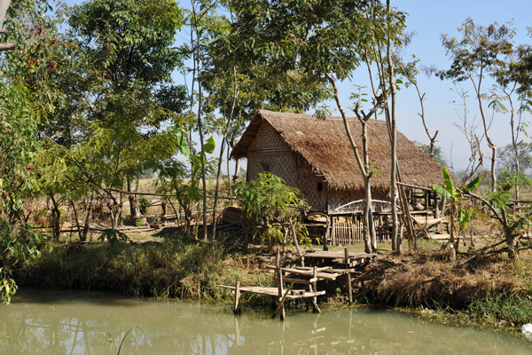 Thatched stilt hut along Mong Li Canal near Nyaungshwe