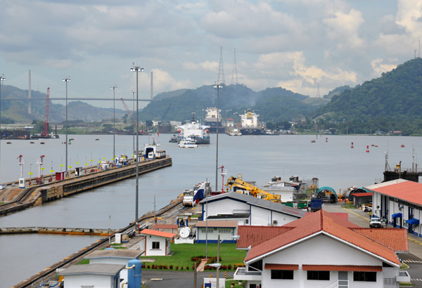 The second set of locks, Pedro Miguel, visible in the distance along with the Centenario Bridge