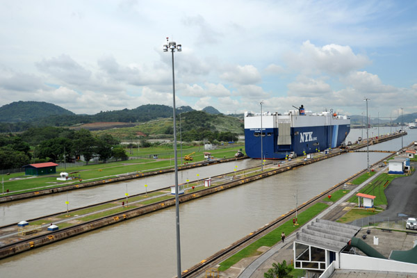 The twin lanes of the Miraflores locks are being augmented by a third channel under construction just west of here 