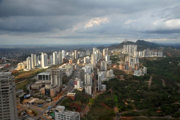 The sun shines through the clouds on the southern hills of Belo Horizonte