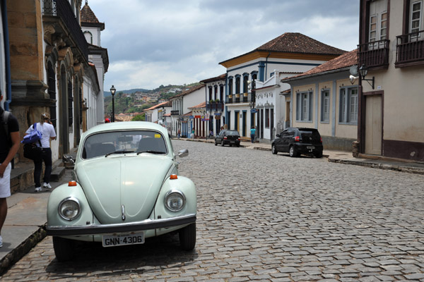 An old VW Beetle on the cobblestone streets of Mariana, Brazil