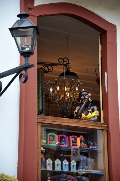 Shop window with a sculpture gazing out