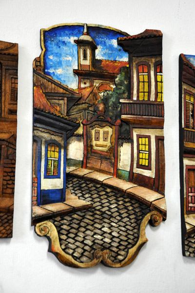 Painted woodcarvings with scenes of Ouro Preto