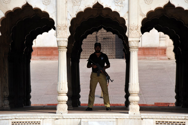 Guard in the Hazuri Bagh Baradari during Friday Prayers at the Badshahi Mosque