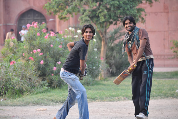 A game of cricket along the southern wall of the Badshahi Mosque